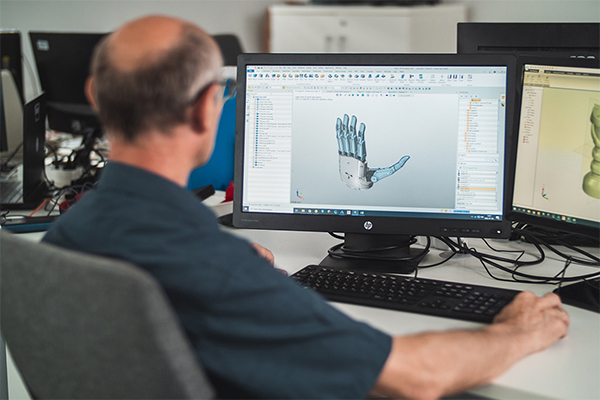A designer worked on the model of a robotic prosthetic hand